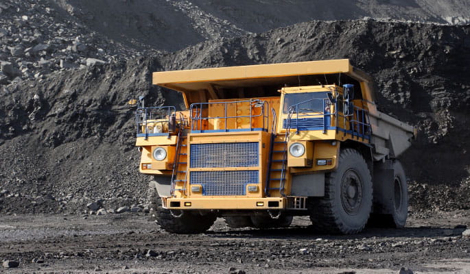 Image of a yellow truck at a mining area