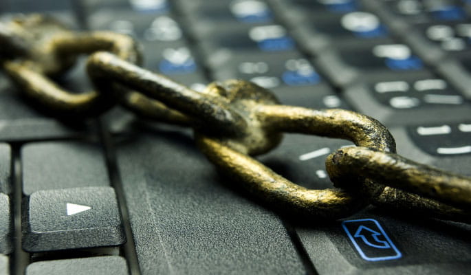 Image of a security chain over a laptop