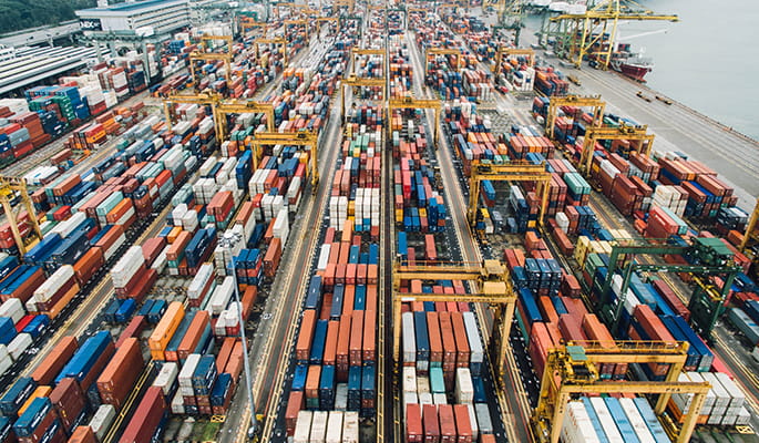 Overhead shot of a busy port full of containers 