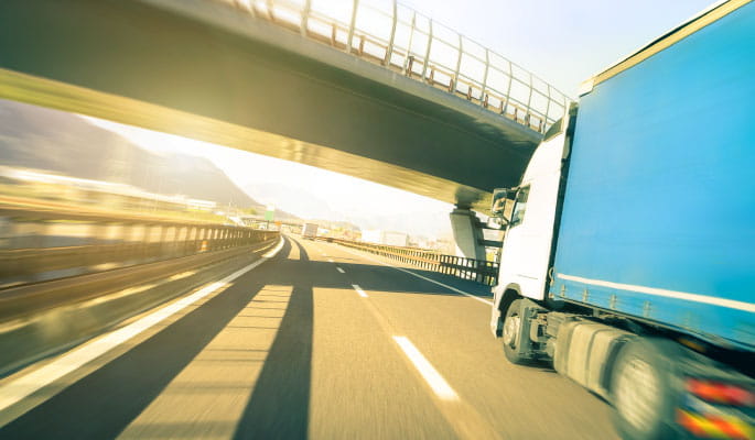 Image of a lorry travelling along a motorway 