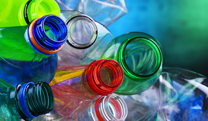 Stacked colourful plastic bottles for recycling