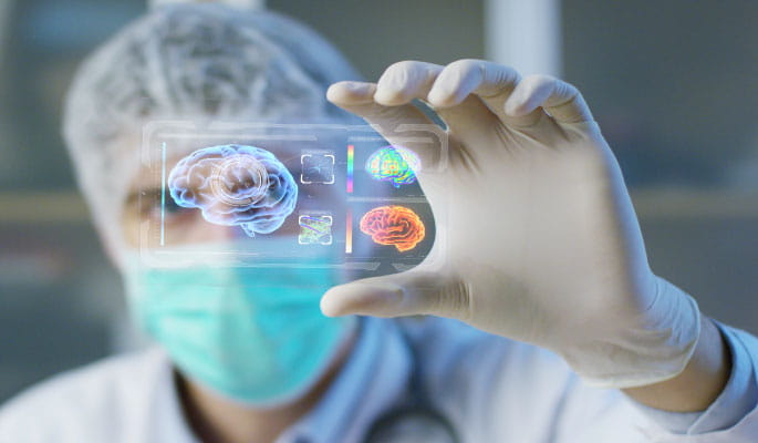 Image of a surgeon analysing a digital image of a brain  