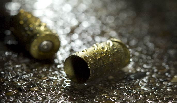 Two bullet shells in the rain