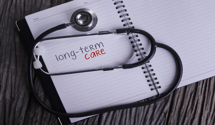 Image of a doctor's stethoscope resting on a writing pad 