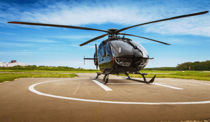 A image of a helicopter on a helipad 