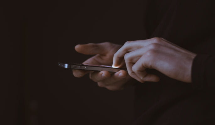Image of hands using a mobile phone