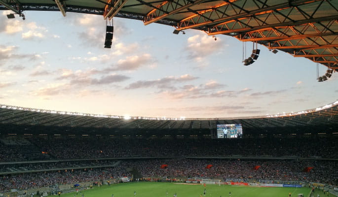 A spectator's view from inside a huge football stadium