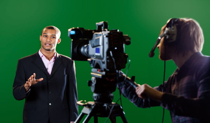 TV Broadcaster in front of camera