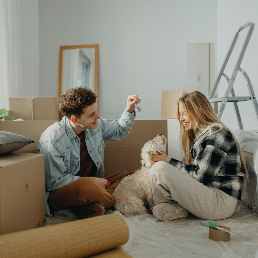 couple and dog moving house